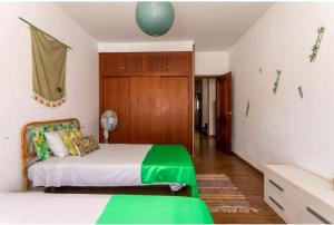 Postel nebo postele na pokoji v ubytování CMHOPE Green Room + 9 fotografií
