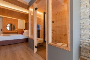 Postel nebo postele na pokoji v ubytování Hotel Alpi