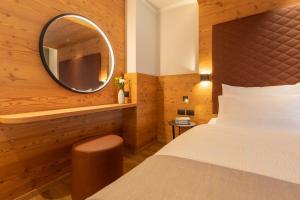 Postel nebo postele na pokoji v ubytování Hotel Alpi