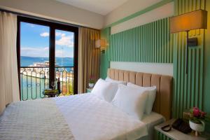 Voodi või voodid majutusasutuse Çanakkale Bosphorus Port Aspen Hotel toas