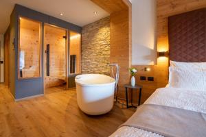 Postel nebo postele na pokoji v ubytování Hotel Alpi