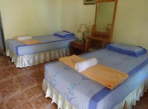 Postel nebo postele na pokoji v ubytování Bird Bungalow Koh Phangan