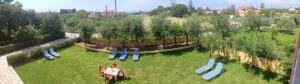 an aerial view of a garden with a playground at Olga's Garden Apartments in Almiros Beach