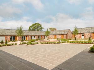 an exterior view of a brick building with a courtyard at Marton in Appleby