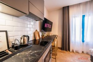 a kitchen with a stove and a counter top at Spinola Stays in St. Julianʼs