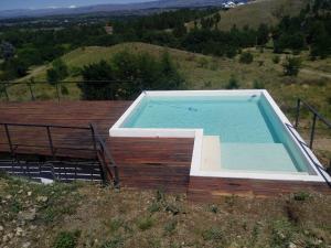 una piscina en la cima de una colina en Housing De La Costa in 