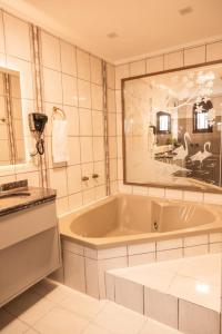 a large bathroom with a tub and a sink at Wine Residence in Garibaldi