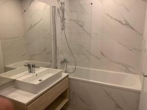 a bathroom with a sink and a shower and a tub at JAD - Luxury - 3 Room Apartments - Urban Plaza in Braşov