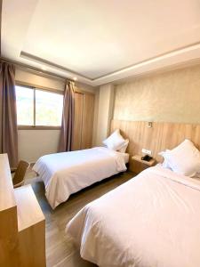 Voodi või voodid majutusasutuse HOTEL CAFE PALAIS SALAM , Beni Mellal toas