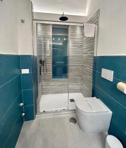 a bathroom with a shower with a toilet and a sink at Sorrento Inn Funzionista in Sorrento