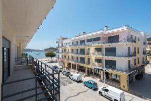 an apartment building with a view of the ocean at Junto á Praia- Junto a Baía in São Martinho do Porto