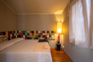 Posteľ alebo postele v izbe v ubytovaní Cottage sul lago - Officina Didattica