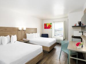Postel nebo postele na pokoji v ubytování Hotel Mesaluna Near American Consulate