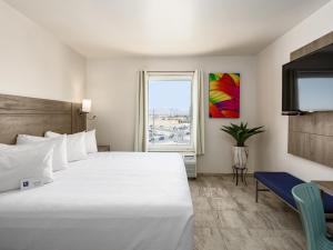 Postel nebo postele na pokoji v ubytování Hotel Mesaluna Near American Consulate