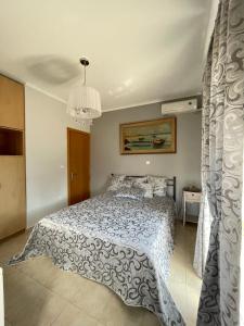 Postel nebo postele na pokoji v ubytování Villa Natalia Nikiti
