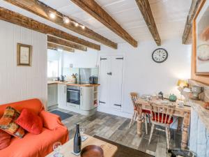 a living room with a couch and a table at Middlehope Cottage in Bishop Auckland