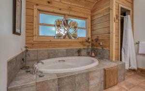 a bathroom with a tub and a window at Blackberry Hill in Newport +58 photos