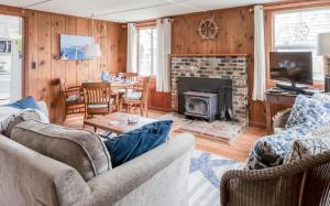 a living room with two couches and a fireplace at Cute Manzanita Beach House MCA 749 - Meredith Lodging in Manzanita