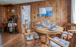 a dining room with a table and chairs at Cute Manzanita Beach House MCA 749 - Meredith Lodging in Manzanita