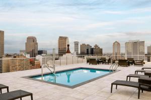 a swimming pool on the roof of a building at Sonder at 1500 Canal in New Orleans