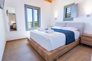 Postel nebo postele na pokoji v ubytování SeaeyeVillas 2