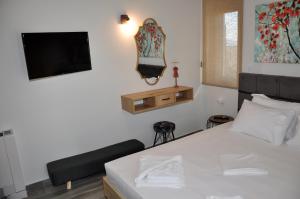 Postel nebo postele na pokoji v ubytování Alkioni's Nest Apartments
