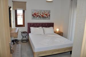 Postel nebo postele na pokoji v ubytování Alkioni's Nest Apartments
