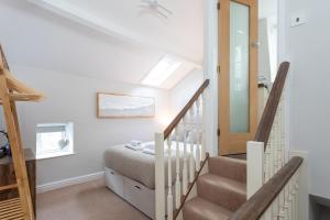 Postel nebo postele na pokoji v ubytování Cobble Cottage + 1 fotografie