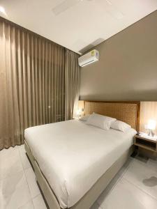 Postel nebo postele na pokoji v ubytování FR Hotel