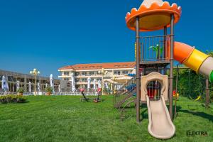 a playground with a slide in a park at Elektra Vama Veche in Vama Veche