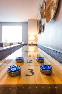 a bowling alley with four blue cookies on the lanes at Monte Cristo Phoenix home in Phoenix