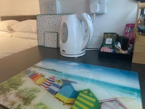 a counter top with a table with a towel on it at Glamping Pod with ensuite WC Near Kingsbridge & Salcombe in Kingsbridge