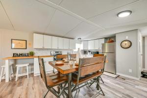 a kitchen and dining room with a table and chairs at Kentucky Vacation Rental Half-Mi to Mammoth Cave! in Sloans Crossing