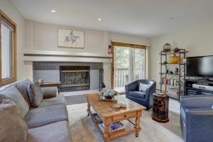 a living room with a couch and a fireplace at Townsend Place in Beaver Creek