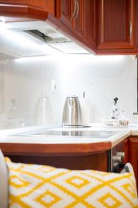 a kitchen with a tea kettle on a counter at Seaside Guesthouse in Kavála