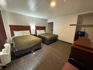 Postel nebo postele na pokoji v ubytování Llano Motel