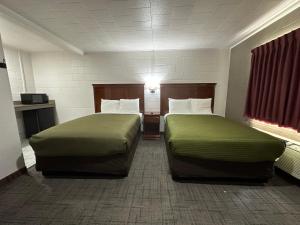Postel nebo postele na pokoji v ubytování Llano Motel