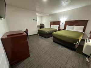 Postel nebo postele na pokoji v ubytování Llano Motel