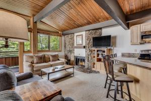 a living room with a couch and a table at Laurelwood Condominiums 311 in Snowmass Village