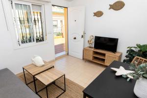 Televízia a/alebo spoločenská miestnosť v ubytovaní Apartamento Pedregalejo Playa