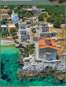 an aerial view of a village next to the water at Family house near the sea in Kokkala