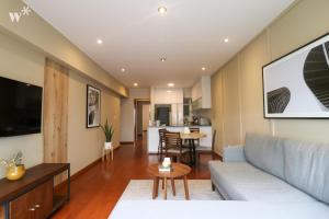 a living room with a couch and a table at Spectacular 1BR in Miraflores in Lima
