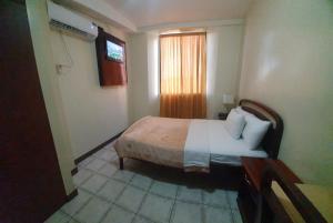 Postel nebo postele na pokoji v ubytování Hotel Cisne II