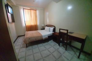 Postel nebo postele na pokoji v ubytování Hotel Cisne II
