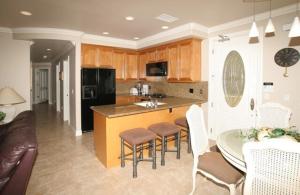 a kitchen with a counter and a table and chairs at 3 Bedroom 2 Bath Beachfront Home in Huntington Beach