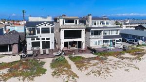 an aerial view of a large house on the beach at 3 Bedroom 2 Bath Beachfront Home in Huntington Beach