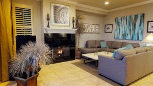 a living room with a couch and a fire place at 3 Bedroom 2 Bath Beachfront Home in Huntington Beach