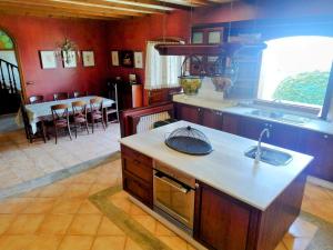 a kitchen with a sink and a counter top at Villa María in Ardán +18 photos
