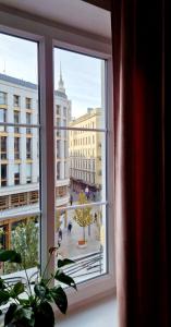 a window with a view of a city at Prywatny pokój w sercu Warszawy in Warsaw