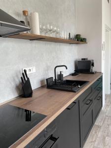 Apartmán Bellaにあるキッチンまたは簡易キッチン